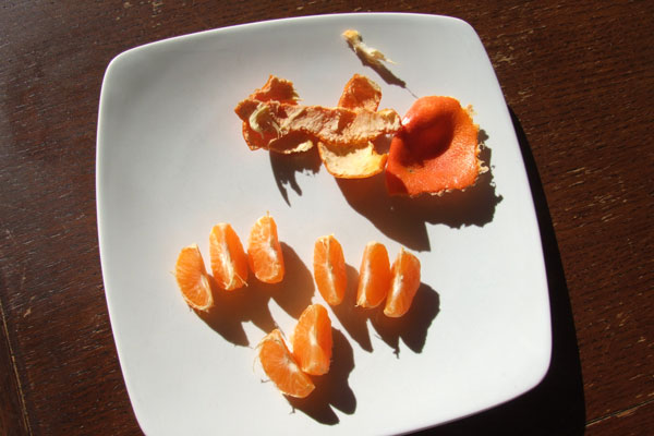 A clementine on a plate