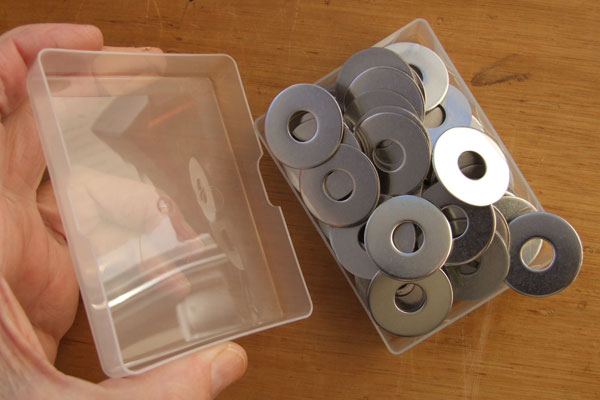 Closing a box lid over 100 washers