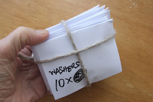 Ten envelopes full of washers