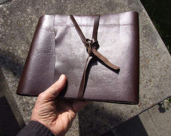 A Columbus Book with leather band closure
