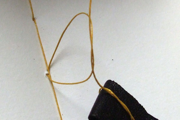 Detail of tying-off the ends threads