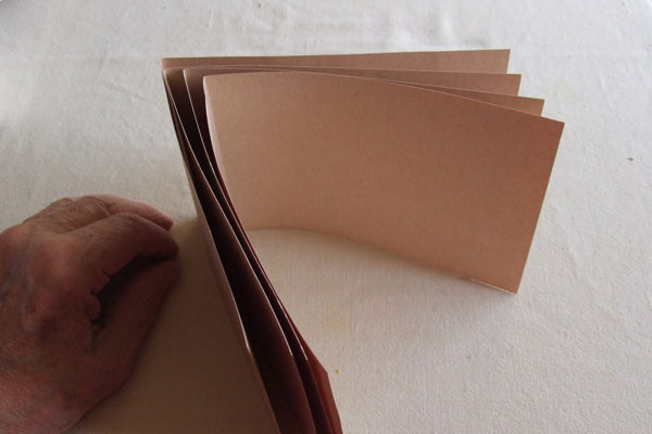 Four folios of light brown corncob paper
