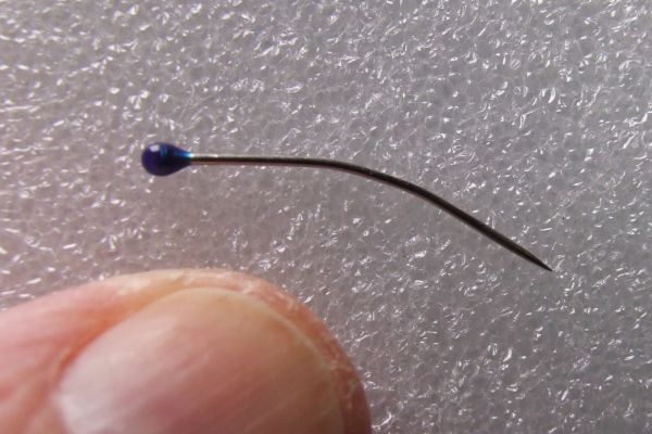 A dressmaker's pin ~ bent with simple hobby use